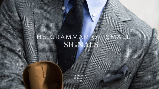 The Grammar of Small Signals: Watches, Cufflinks, and the Suspender